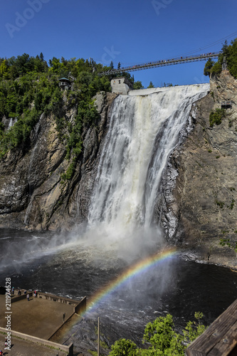 The Montmorency waterfall and bridge over waterfall. Montmorency falls, located between the river and the cliffs (10 km east of Quebec City): 275 feet (83 meters) high. Quebec, Canada, North America.