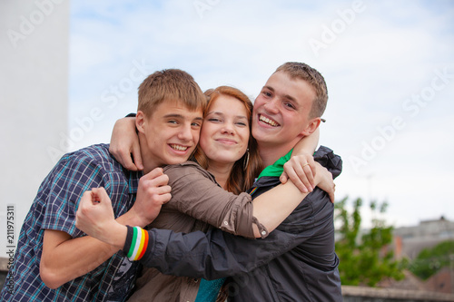 Portrait of three happy young teenagers