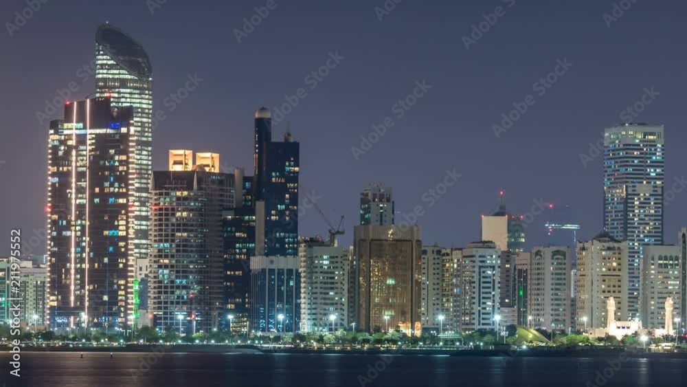 Panorama view of Abu Dhabi Skyline and seafront at night timelapse, United Arab Emirates Panorama view of Abu Dhabi Skyline and seafront at night timelapse, United Arab Emirates