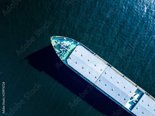 Photo close up part of big barge on the sea water texture directly above overhead view