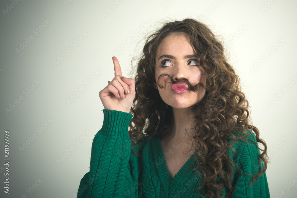 Obraz premium Retro girl with stylish makeup and hair in paris. retro fashion style of parisian woman with long curly hair in green sweater.