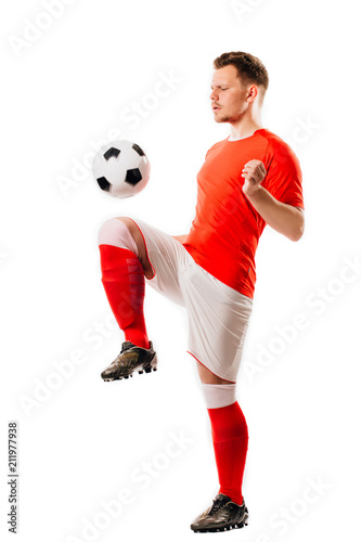 Young soccer player with ball on black background in studio. © photominus21