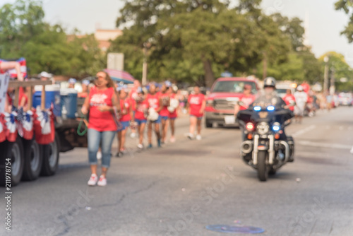 Blurred traditional July 4th parade in Irving, Texas, USA