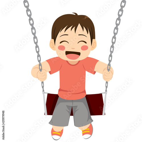 Cute little boy happy playing on swing having fun on playground