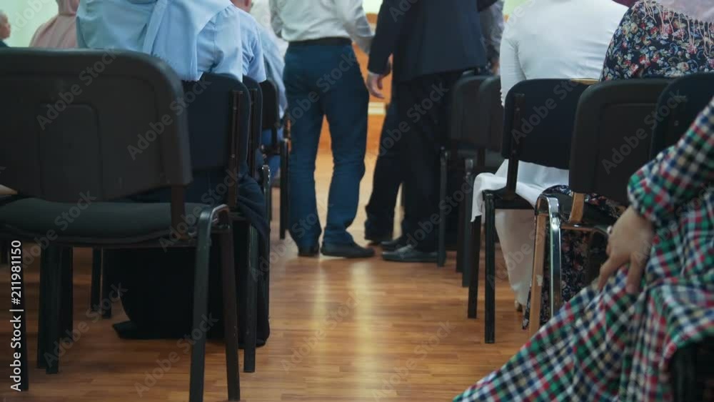 Muslim people at the education conference - rear view