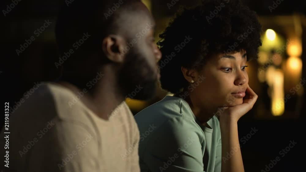 Offended girl looking sadly at boyfriend, relations difficulties, disappointment Offended girl looking sadly at boyfriend, relations difficulties, disappointment