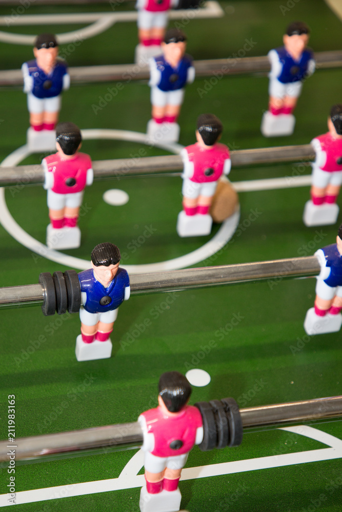 foosball tabletop version of soccer in which players turn rods fixed on top of a playing box and attached to miniature figures of players foosball tabletop version of soccer in which players turn rods fixed on top of a playing box and attached to miniature figures of players