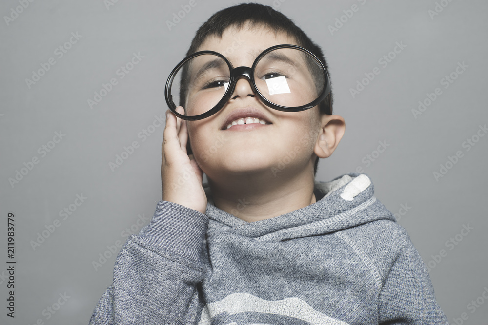Schoolboy with big glass glasses putting funny faces, boredom, worry, anguish Schoolboy with big glass glasses putting funny faces, boredom, worry, anguish