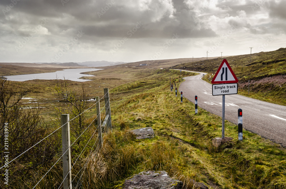 Road attention sign, single track road. Scottish landscape. Scotland, Great Britain Road attention sign, single track road. Scottish landscape. Scotland, Great Britain