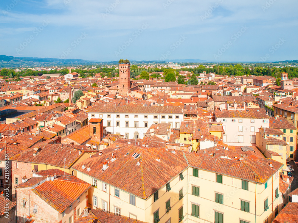 Lucca cityscape lookout from Torre delle Ore. Red rooftops and Guinigi Tower, Lucca, Tuscany, Italy.