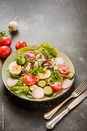 Salad from fresh vegetables and eggs for proper nutrition. Summer food.