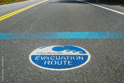 Tsunami evacuation route road sign on the asphalt, Highway 101, Oregon, USA.