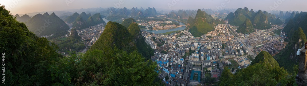 Sunset with Yanghsuo skyline nestled in between karst mountains with bendy Li River