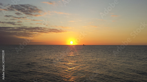 Fototapeta Naklejka Na Ścianę i Meble -  Sunrise over the oil towers and offshore oil rigs 