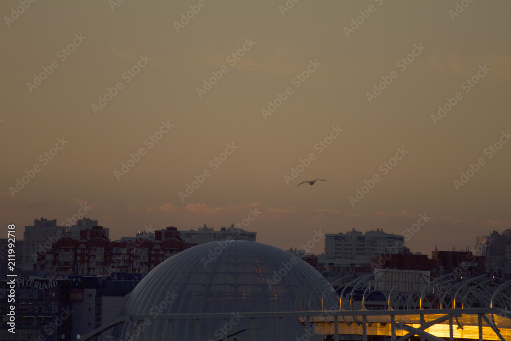 Sunset over the city. Twilight and buildings landscape. Bright sunset over the horizon Sunset over the city. Twilight and buildings landscape. Bright sunset over the horizon