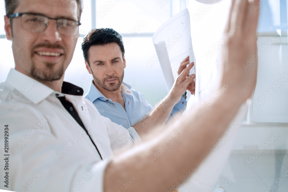 Fototapeta premium close up.two architects working in a modern office