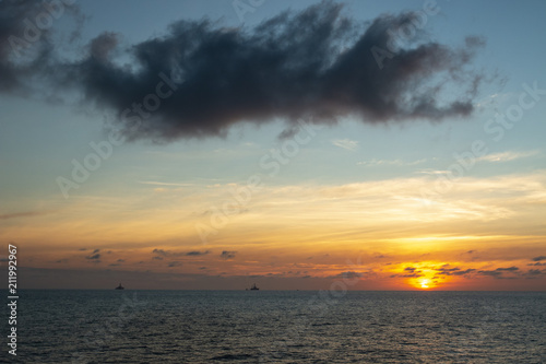 Sunrise over the oil towers and offshore oil rigs 