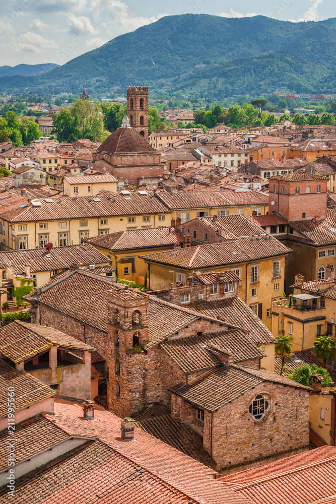 Panorama of the medieval center of Lucca with ancient towers, churches and roofs