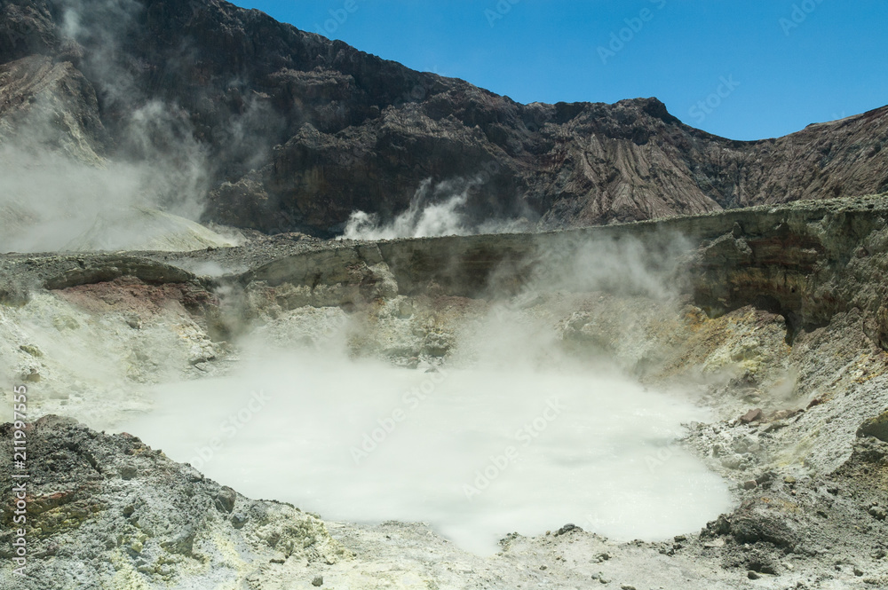 Thermal activity in the crater of the active volcano of White Island, Whakaari, off the Bay of Plenty coast, New Zealand. Pool of boiling water in the foreground.