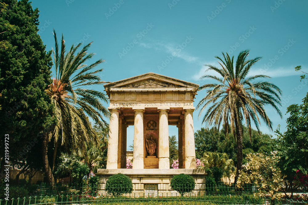 Monument with colums to Alexander Ballower in Barrakka public garden in old town of Valletta, Malta. Sunny summer day