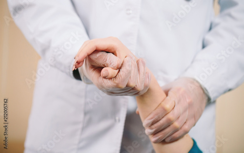 Doctor holding girl's hand