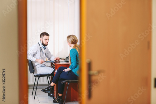 A patient at the doctor at the reception.