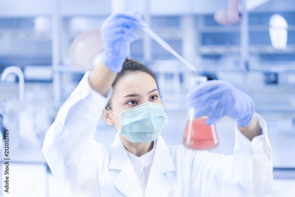 Female scientist working in the laboratory Female scientist working in the laboratory
