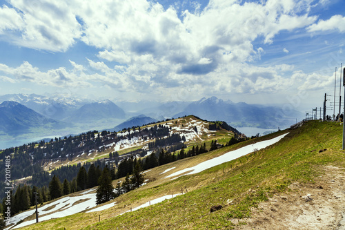 Landscape view of Alps snow mountain with pine tree looking from Rigi kulm Luzern Switzerland