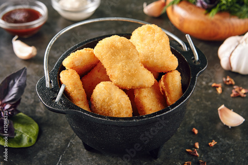 Delicious Chicken Nuggets in Metal Bowler photo