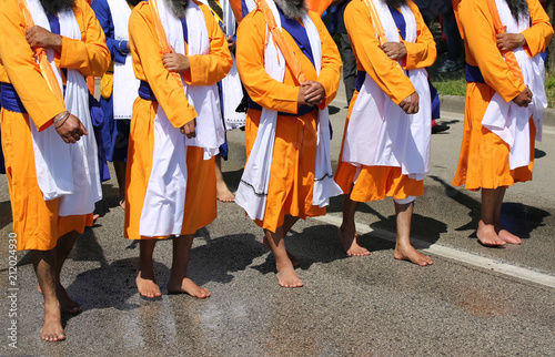 Sikh soldiers barefootduring a religious celebration