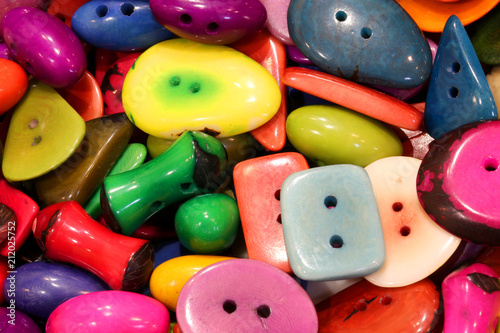 colored buttons of different shapes in a haberdashery photo