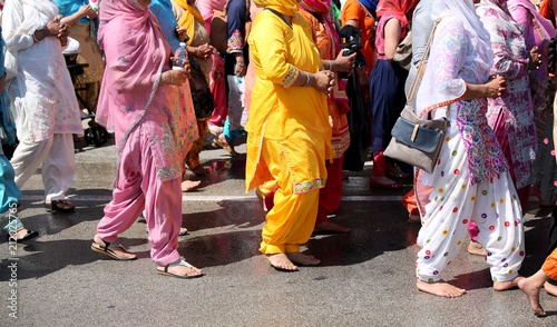 barefoot women at a Sikh religious parade