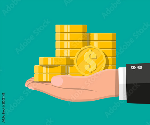 Stacks of gold coins in hand