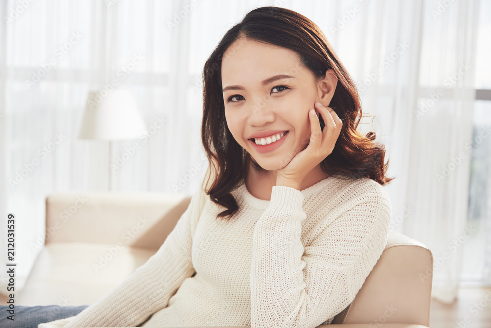 Young woman resting in armchair Young woman resting in armchair