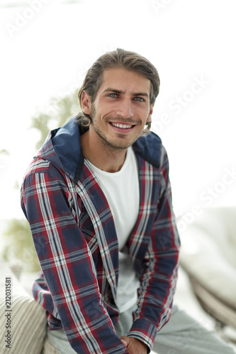 stylish young man in plaid shirt.