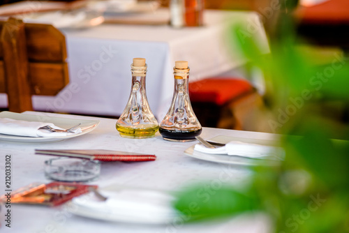 Olive oil and spices on the table in the restaurant