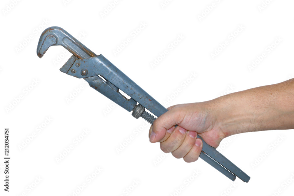 Obraz premium adjustable wrench in a hand on a white background
