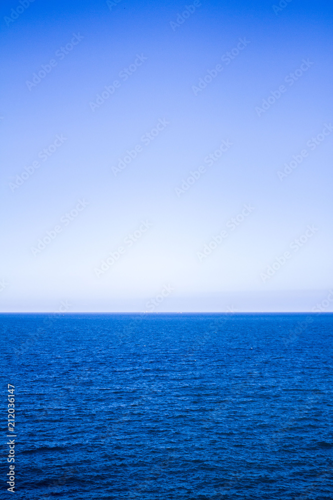 Blue sea water surface on sky