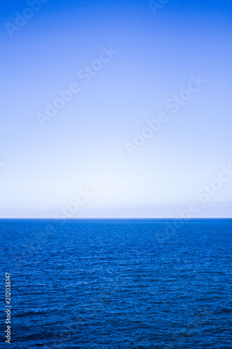 Blue sea water surface on sky