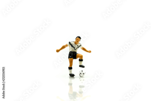 Miniature people   Soccer player man football world championship cup concept.