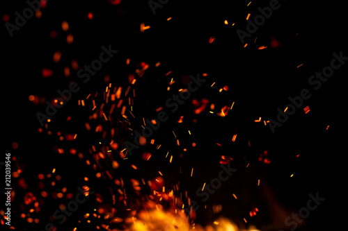 flame of fire with sparks on a black background