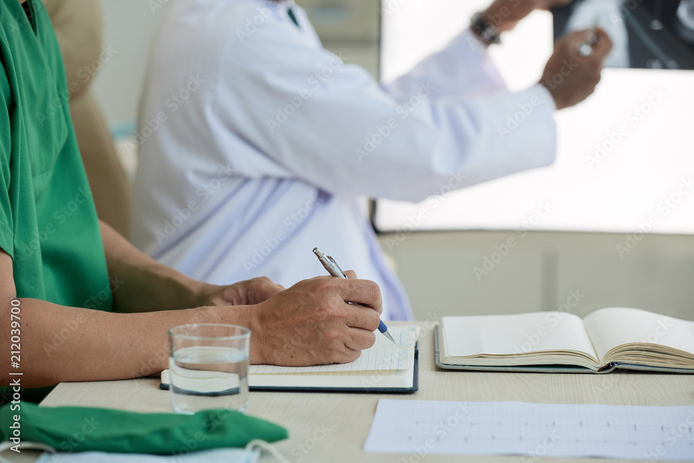 Crdiologist working at table Crdiologist working at table