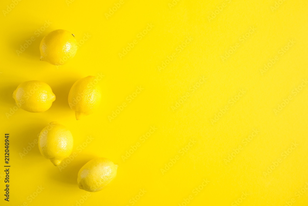 Yellow background. Lemon fruit. Flat lay, top view, copy space Yellow background. Lemon fruit. Flat lay, top view, copy space