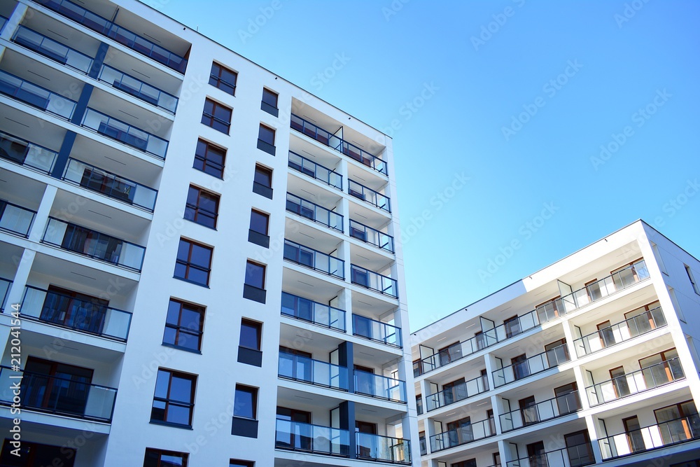 Brand new apartment building on sunny day Brand new apartment building on sunny day