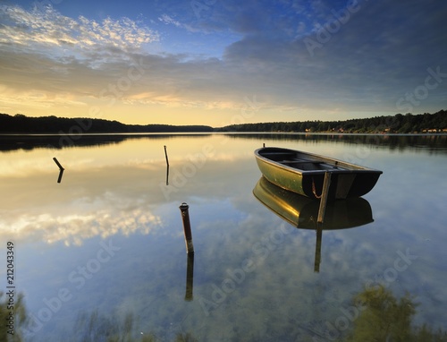 Rowboat in Lake Wutzsee, morning atmosphere, Lindow, Brandenburg, Germany, Europe photo