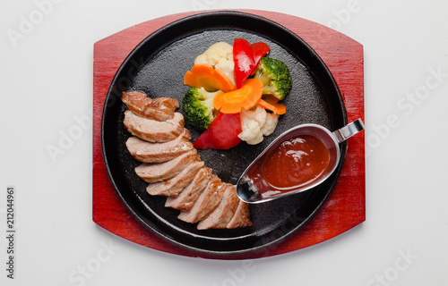fried duck with vegetables and sauce