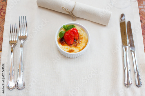 cream brulee with strawberry and mint