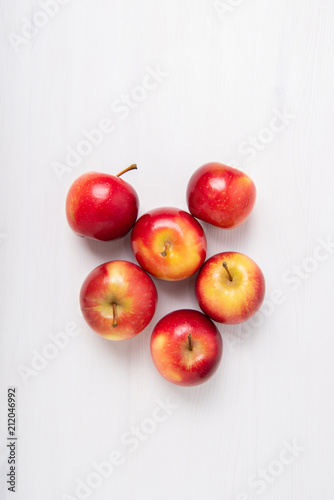 Fresh apples on white background with negative space.