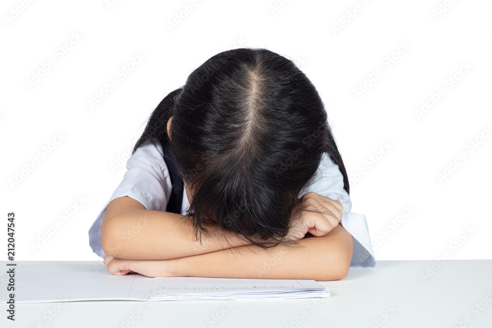 Asian Chinese little girl in school uniform sleeping on the table Asian Chinese little girl in school uniform sleeping on the table