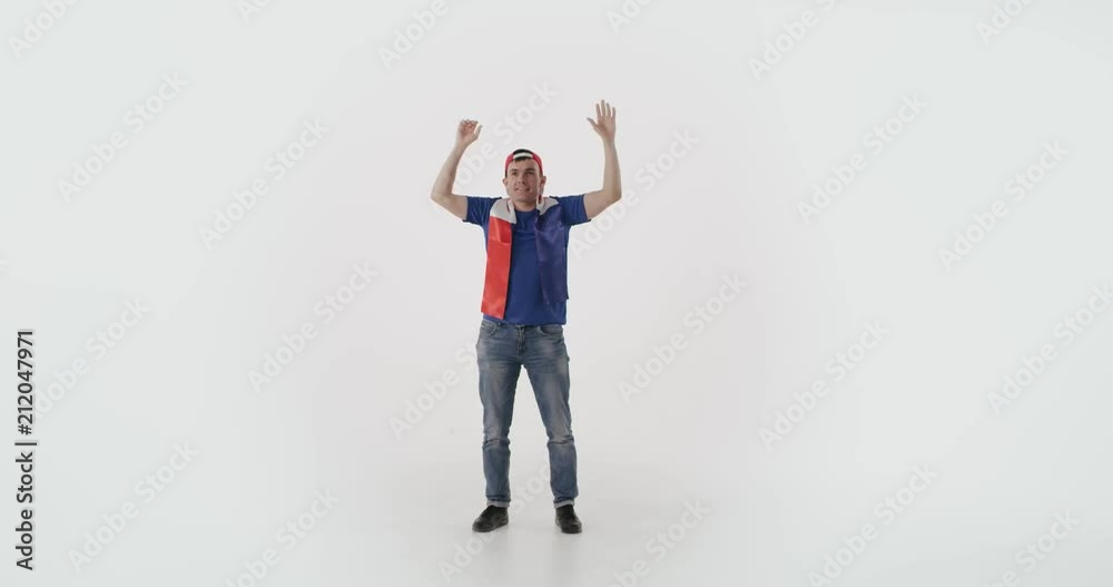 Happy French football fan raising hands to celebrate successful play. Happy French football fan raising hands to celebrate successful play.